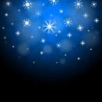 Snowflakes Blue Background Shows Frozen Shiny Stars
 Stock Photo