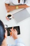 Two Business Woman Working In Office With Digital Tablet Stock Photo