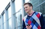 Casual Man Hearing Music Outside Modern Building Stock Photo