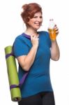 Curvy Woman Carrying Yoga Mat Stock Photo