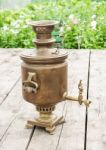 Brass Samovar On A Wooden Table Stock Photo