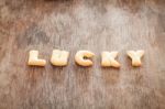 Lucky Alphabet Biscuit On Wooden Table Stock Photo