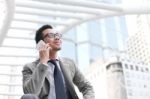 Asia Businessman Using A Mobile Phone Stock Photo