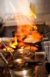 Chef Cooking In Kitchen Stove Stock Photo