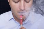 Men Smoke An Electronic Cigarette Stock Photo