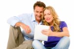 Couple Using Digital Tablet Stock Photo