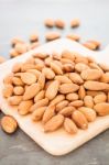 Almond Nuts On Wooden Plate Stock Photo