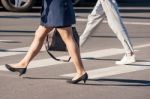 Two Pedestrians Walking Stock Photo