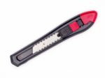 Black And Red Plastic Cutter Knife Isolated Stock Photo