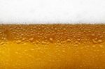 Close-up Picture Of A Beer With Foam And Bubbles Stock Photo