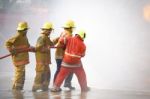 Fireman. Firefighters Fighting Fire During Training Stock Photo