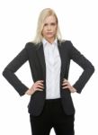 Businesswoman With Arms On Hips Stock Photo