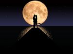 Moonset Couple Stock Photo