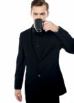 Young Man Drinking Coffee Stock Photo