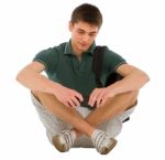 Teenage Student Sitting On Floor Stock Photo