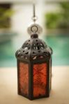 Red Metal Lantern Over Swimming Pool Background Stock Photo