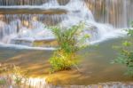 The Water Flowing Over Rocks And Trees Down A Waterfall At Huay Mae Khamin Waterfall National Park ,kanchana Buri In Thailand Stock Photo