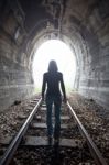 Man In A Tunnel Looking Towards The Light Stock Photo