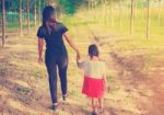 Two Hands Holding Puzzle Mother And Child,the Woman And Child Holding Hands At Sunset Stock Photo