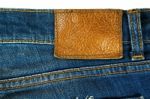 Brown Leather Label On Blue Jeans Stock Photo