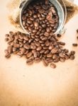 Coffee Roasted Bean In The Bucket On Wooden Background Stock Photo