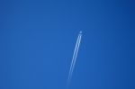 A Long Trail Of Jet Plane On Blue Sky Stock Photo