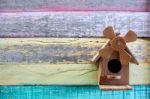 Wooden Bird House On Grunge Colorful Wooden Panel Stock Photo