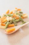 Raw Fusilli Pasta On Wooden Tray Stock Photo