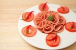 Slices Of Ham On White  Plate With Tomato And Chili Stock Photo