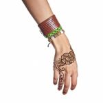 Mehendi Or Henna Tatoo On The Female Hands In Bracelets Isolated Stock Photo