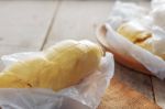 Durian Pieces On Wooden Stock Photo