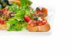 Original Italian Fresh Bruschetta Served With Fresh Salad And Ve Stock Photo