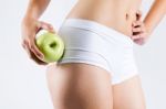 Beautiful Young Woman In White Underwear Holding Green Apple Stock Photo