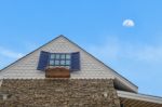 Traditional Gable House With Moon Sky Stock Photo