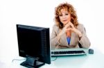 Corporate Feminine At Her Desk Stock Photo