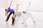 Diverse Group Of People Practicing Yoga In Fitness Studio Stock Photo