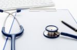 Medical Stethoscope With Clipboard On Table Stock Photo