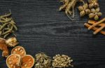 Dried Herbs And Ginseng, Top View Of Thai Herbs And Ginseng On Wooden Floor Stock Photo