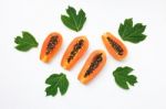 Papaya With Leaf On White Background Stock Photo