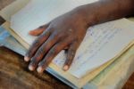 Hand On The Notebooks Stock Photo