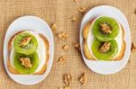 Toast With Kiwi, Cheese And Walnuts Stock Photo