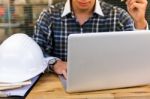 Engineer Working At His Laptop In The Office Stock Photo