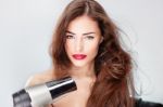 Woman Drying Hair Stock Photo