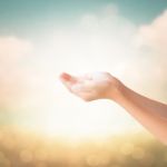 Hands Of Little Girl On Natural Background Stock Photo