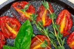 Baked Cherry Tomatoes With Basil And Thyme Stock Photo