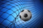 Soccer Football And Goal Net On Blue Background Stock Photo