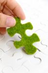 Green Puzzle Piece Stock Photo