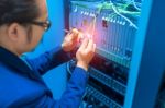 People Fix Node Fiber Optic In Network Room Stock Photo