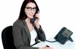 Young Businesswoman Holding Phone Receiver Stock Photo