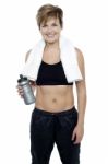 Charming Fit Lady Holding Up A Bottle Of Water Stock Photo